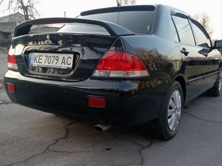 Черный Мицубиси Лансер, объемом двигателя 1.6 л и пробегом 190 тыс. км за 4600 $, фото 1 на Automoto.ua