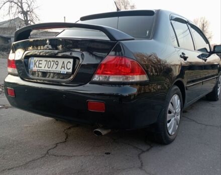 Черный Мицубиси Лансер, объемом двигателя 1.6 л и пробегом 190 тыс. км за 4600 $, фото 1 на Automoto.ua