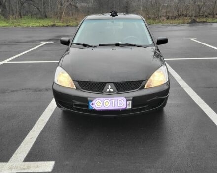 Черный Мицубиси Лансер, объемом двигателя 1.6 л и пробегом 170 тыс. км за 5000 $, фото 1 на Automoto.ua