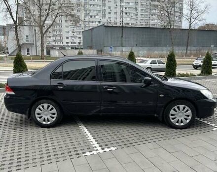 Черный Мицубиси Лансер, объемом двигателя 1.6 л и пробегом 415 тыс. км за 4100 $, фото 1 на Automoto.ua