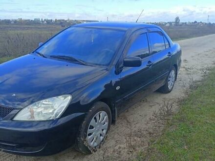 Міцубісі Lancer 2008 у Барышевке на Automoto.ua Чорний Міцубісі Lancer, об'ємом двигуна 1.58 л та пробігом 172 тис. км за 4500 $, фото 1 на Automoto.ua