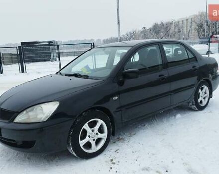 Черный Мицубиси Лансер, объемом двигателя 1.58 л и пробегом 143 тыс. км за 4999 $, фото 1 на Automoto.ua