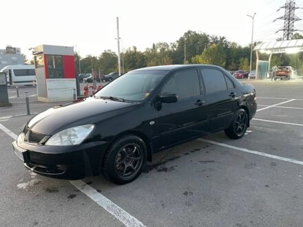 Чорний Міцубісі Lancer, об'ємом двигуна 2 л та пробігом 242 тис. км за 4000 $, фото 1 на Automoto.ua