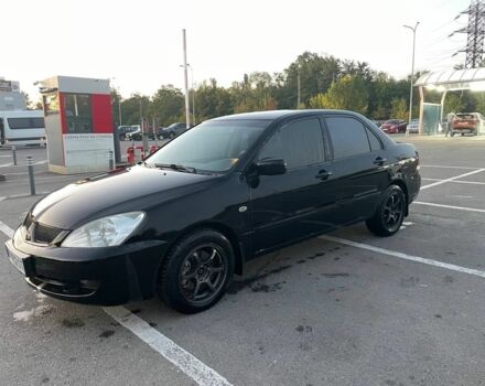 Чорний Міцубісі Lancer, об'ємом двигуна 2 л та пробігом 242 тис. км за 4000 $, фото 1 на Automoto.ua