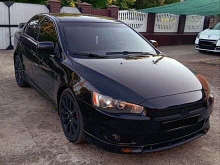 Чорний Міцубісі Lancer, об'ємом двигуна 2 л та пробігом 124 тис. км за 5400 $, фото 1 на Automoto.ua
