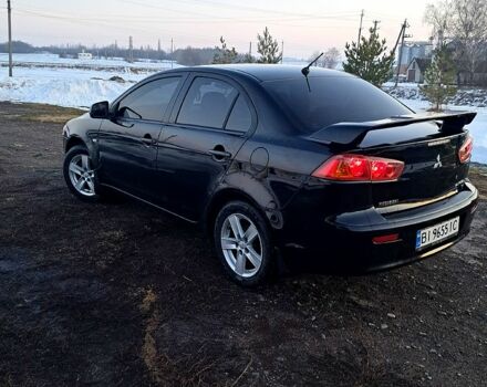 Черный Мицубиси Лансер, объемом двигателя 1.5 л и пробегом 26000 тыс. км за 5900 $, фото 1 на Automoto.ua