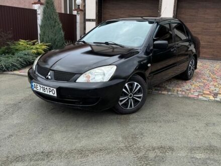 Черный Мицубиси Лансер, объемом двигателя 1.6 л и пробегом 220 тыс. км за 3600 $, фото 1 на Automoto.ua