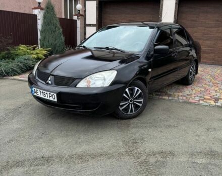 Черный Мицубиси Лансер, объемом двигателя 1.6 л и пробегом 220 тыс. км за 3600 $, фото 1 на Automoto.ua