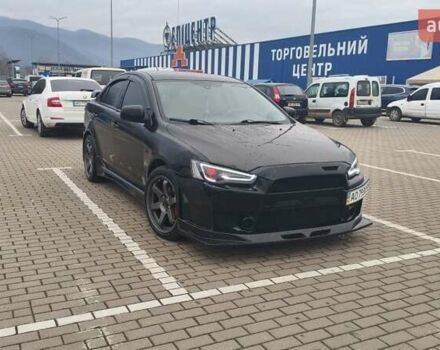 Черный Мицубиси Лансер, объемом двигателя 2 л и пробегом 160 тыс. км за 8000 $, фото 1 на Automoto.ua