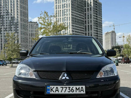 Черный Мицубиси Лансер, объемом двигателя 1.6 л и пробегом 321 тыс. км за 5000 $, фото 1 на Automoto.ua