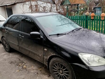 Черный Мицубиси Лансер, объемом двигателя 1.6 л и пробегом 126 тыс. км за 4500 $, фото 1 на Automoto.ua