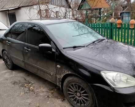 Чорний Міцубісі Lancer, об'ємом двигуна 1.6 л та пробігом 126 тис. км за 4500 $, фото 1 на Automoto.ua