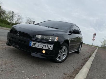 Чорний Міцубісі Lancer, об'ємом двигуна 2 л та пробігом 200 тис. км за 7600 $, фото 1 на Automoto.ua