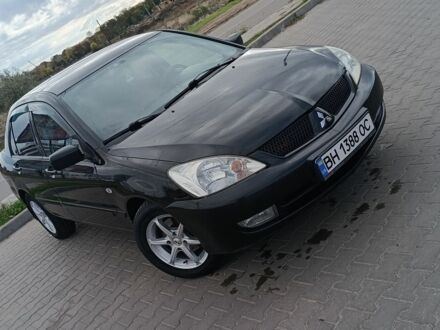 Черный Мицубиси Лансер, объемом двигателя 1.6 л и пробегом 240 тыс. км за 4500 $, фото 1 на Automoto.ua