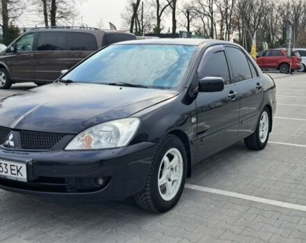 Черный Мицубиси Лансер, объемом двигателя 1.6 л и пробегом 210 тыс. км за 4000 $, фото 1 на Automoto.ua