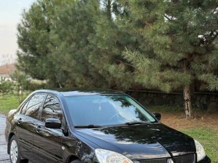 Чорний Міцубісі Lancer, об'ємом двигуна 1.6 л та пробігом 98 тис. км за 5600 $, фото 1 на Automoto.ua