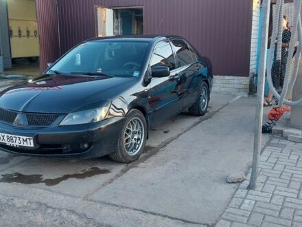 Черный Мицубиси Лансер, объемом двигателя 1.6 л и пробегом 340 тыс. км за 4500 $, фото 1 на Automoto.ua