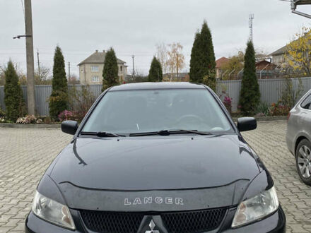 Черный Мицубиси Лансер, объемом двигателя 1.58 л и пробегом 287 тыс. км за 4750 $, фото 1 на Automoto.ua