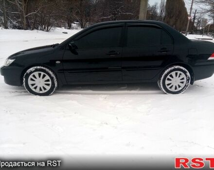 Черный Мицубиси Лансер, объемом двигателя 1.6 л и пробегом 94 тыс. км за 6200 $, фото 1 на Automoto.ua