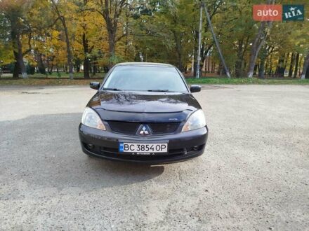 Чорний Міцубісі Lancer, об'ємом двигуна 1.58 л та пробігом 78 тис. км за 6500 $, фото 1 на Automoto.ua