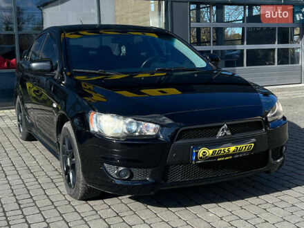 Черный Мицубиси Лансер, объемом двигателя 2 л и пробегом 215 тыс. км за 7000 $, фото 1 на Automoto.ua