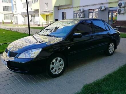 Чорний Міцубісі Lancer, об'ємом двигуна 1.58 л та пробігом 292 тис. км за 5500 $, фото 1 на Automoto.ua