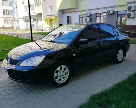 Чорний Міцубісі Lancer, об'ємом двигуна 1.58 л та пробігом 292 тис. км за 5500 $, фото 1 на Automoto.ua
