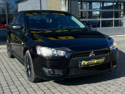 Черный Мицубиси Лансер, объемом двигателя 2 л и пробегом 215 тыс. км за 7000 $, фото 1 на Automoto.ua