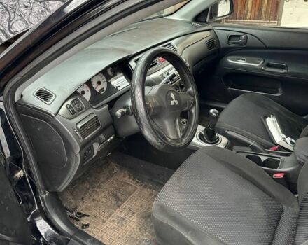 Черный Мицубиси Лансер, объемом двигателя 1.6 л и пробегом 190 тыс. км за 1500 $, фото 1 на Automoto.ua