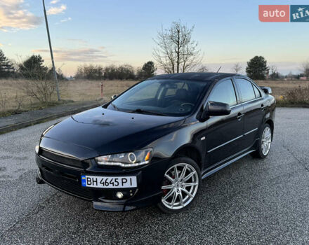 Черный Мицубиси Лансер, объемом двигателя 2 л и пробегом 217 тыс. км за 6412 $, фото 1 на Automoto.ua