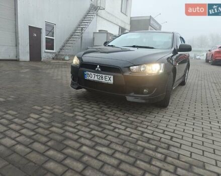 Черный Мицубиси Лансер, объемом двигателя 2 л и пробегом 228 тыс. км за 7000 $, фото 1 на Automoto.ua