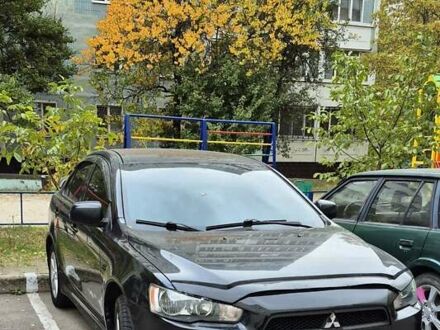 Черный Мицубиси Лансер, объемом двигателя 2 л и пробегом 230 тыс. км за 6800 $, фото 1 на Automoto.ua