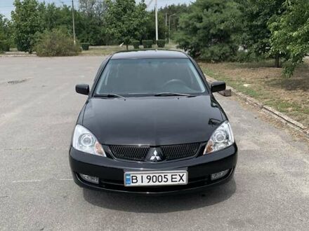 Чорний Міцубісі Lancer, об'ємом двигуна 1.58 л та пробігом 240 тис. км за 5100 $, фото 1 на Automoto.ua
