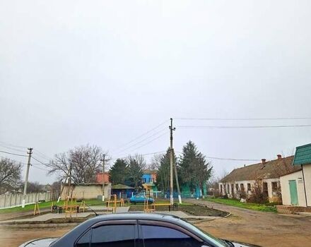 Черный Мицубиси Лансер, объемом двигателя 1.6 л и пробегом 300 тыс. км за 3500 $, фото 1 на Automoto.ua