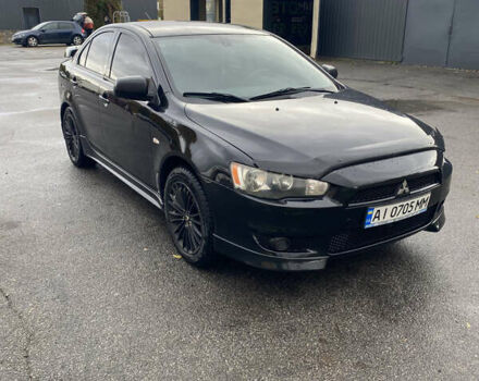 Чорний Міцубісі Lancer, об'ємом двигуна 2 л та пробігом 291 тис. км за 7500 $, фото 1 на Automoto.ua