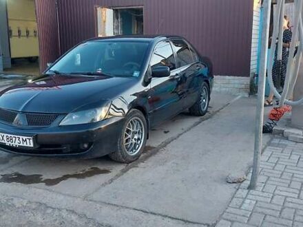 Чорний Міцубісі Lancer, об'ємом двигуна 1.58 л та пробігом 345 тис. км за 4500 $, фото 1 на Automoto.ua