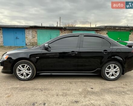 Чорний Міцубісі Lancer, об'ємом двигуна 2 л та пробігом 203 тис. км за 7000 $, фото 1 на Automoto.ua