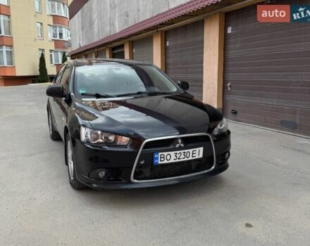 Черный Мицубиси Лансер, объемом двигателя 2 л и пробегом 239 тыс. км за 6500 $, фото 1 на Automoto.ua