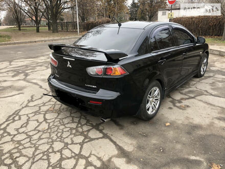 Чорний Міцубісі Lancer, об'ємом двигуна 2 л та пробігом 138 тис. км за 7500 $, фото 1 на Automoto.ua