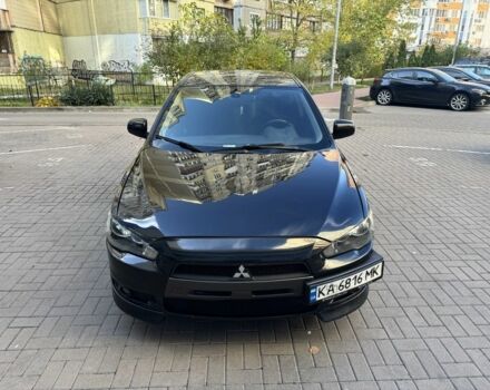 Черный Мицубиси Лансер, объемом двигателя 2 л и пробегом 189 тыс. км за 5700 $, фото 1 на Automoto.ua