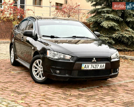 Черный Мицубиси Лансер, объемом двигателя 2 л и пробегом 169 тыс. км за 6800 $, фото 1 на Automoto.ua