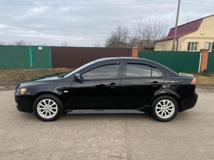 Черный Мицубиси Лансер, объемом двигателя 2 л и пробегом 50 тыс. км за 8300 $, фото 1 на Automoto.ua