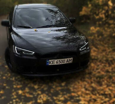 Черный Мицубиси Лансер, объемом двигателя 1.59 л и пробегом 122 тыс. км за 8000 $, фото 1 на Automoto.ua