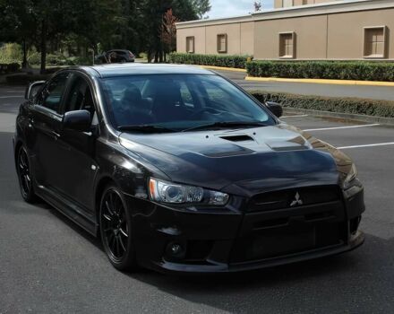 Чорний Міцубісі Lancer, об'ємом двигуна 2 л та пробігом 82 тис. км за 11000 $, фото 1 на Automoto.ua