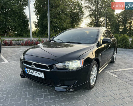 Чорний Міцубісі Lancer, об'ємом двигуна 2 л та пробігом 213 тис. км за 9599 $, фото 1 на Automoto.ua