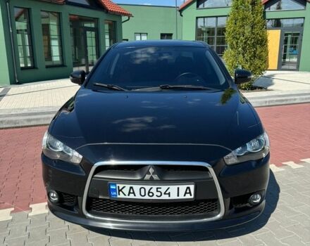 Черный Мицубиси Лансер, объемом двигателя 1.59 л и пробегом 130 тыс. км за 10000 $, фото 1 на Automoto.ua