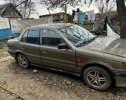 Коричневий Міцубісі Lancer, об'ємом двигуна 1.8 л та пробігом 200 тис. км за 1136 $, фото 1 на Automoto.ua