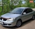 Коричневый Мицубиси Лансер, объемом двигателя 1.58 л и пробегом 200 тыс. км за 4400 $, фото 1 на Automoto.ua