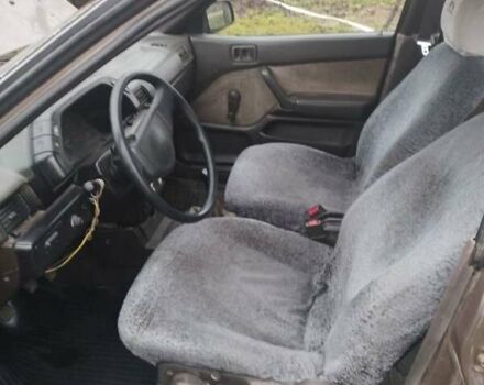 Коричневий Міцубісі Lancer, об'ємом двигуна 1.5 л та пробігом 200 тис. км за 700 $, фото 5 на Automoto.ua