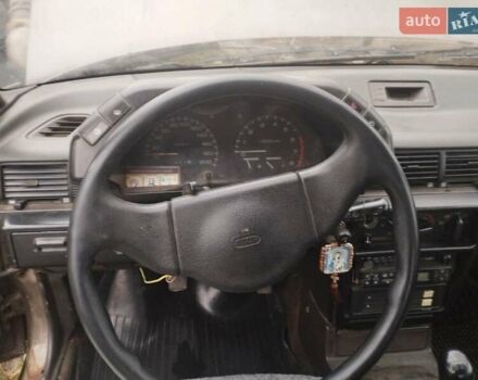 Коричневий Міцубісі Lancer, об'ємом двигуна 1.5 л та пробігом 200 тис. км за 700 $, фото 4 на Automoto.ua